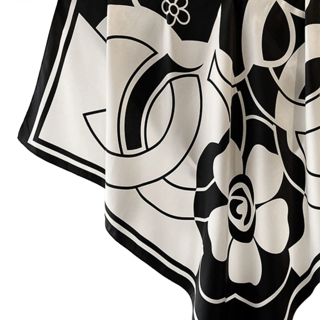 Apaszka 90x90 cm w klasycznej czerni i bieli, idealna do noszenia z płaszczem lub marynarką | KAMEA | Spironik.pl