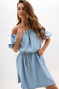 A midi dress with elastic waistband and pockets. Light blue.