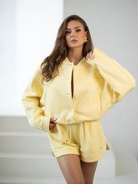 Tracksuit bomber jacket with logo - stand-up collar, buttons, and lining. Color: Yellow (yellow lettering)