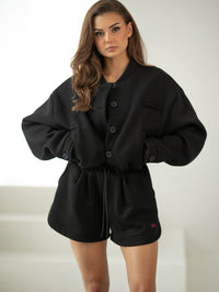 Bomber jacket with logo - stand-up collar, buttons, and lining. Color: Black (silver lettering)