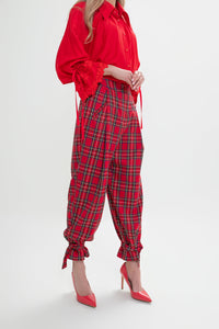 Women's checkered trousers with pleats. Color: Red