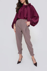 Classic women's trousers with pleats and a belt at the legs. Color: Beige