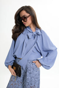 Women's blouse with a bow and gathered neckline. Color: Light denim blue