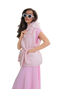 Women's quilted vest with hood and belt. Pink color.